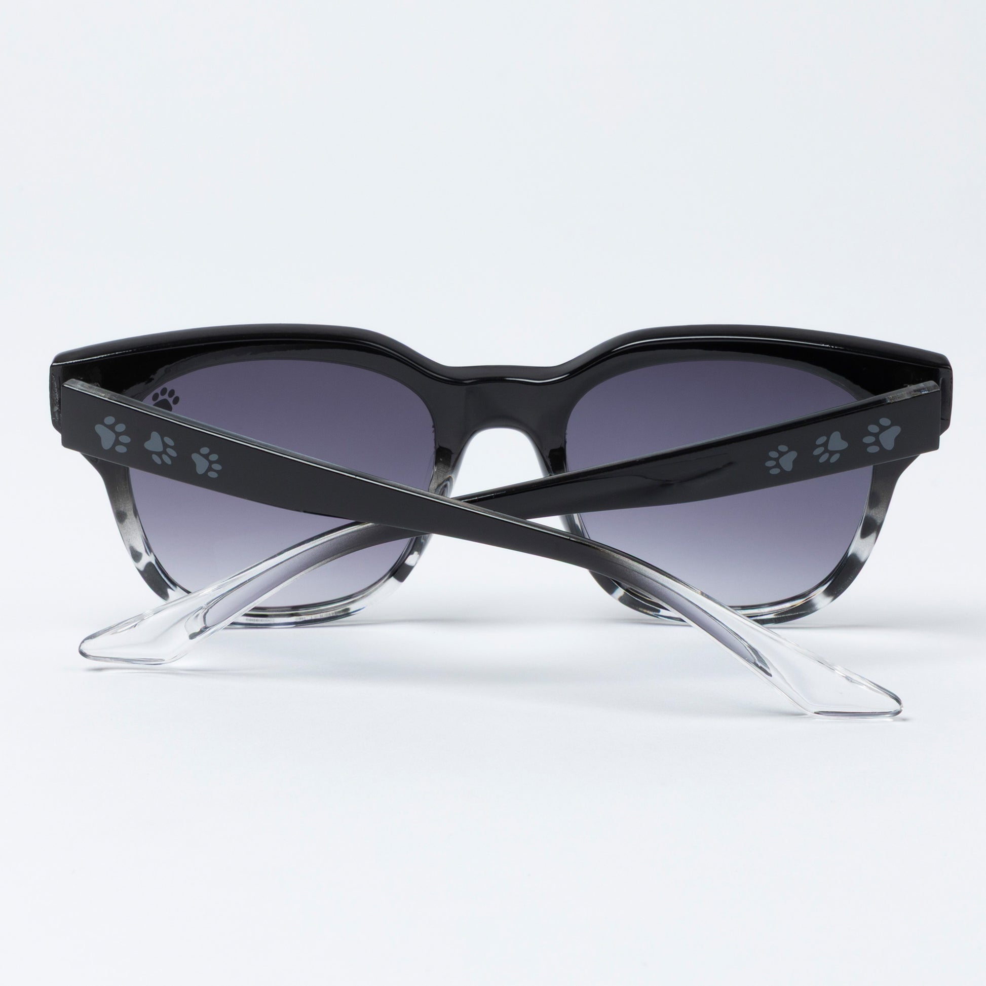 Black cat-eye sunglasses with paw print details on a white background