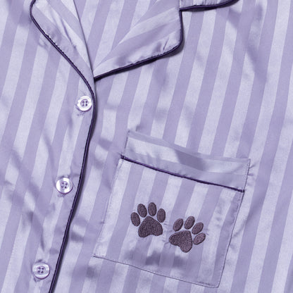 Striped pajama top with paw print pocket detail