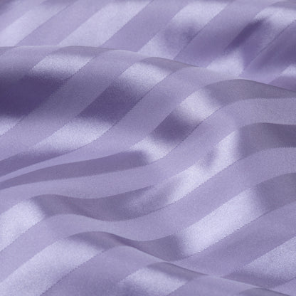 Close-up of purple satin fabric with stripes