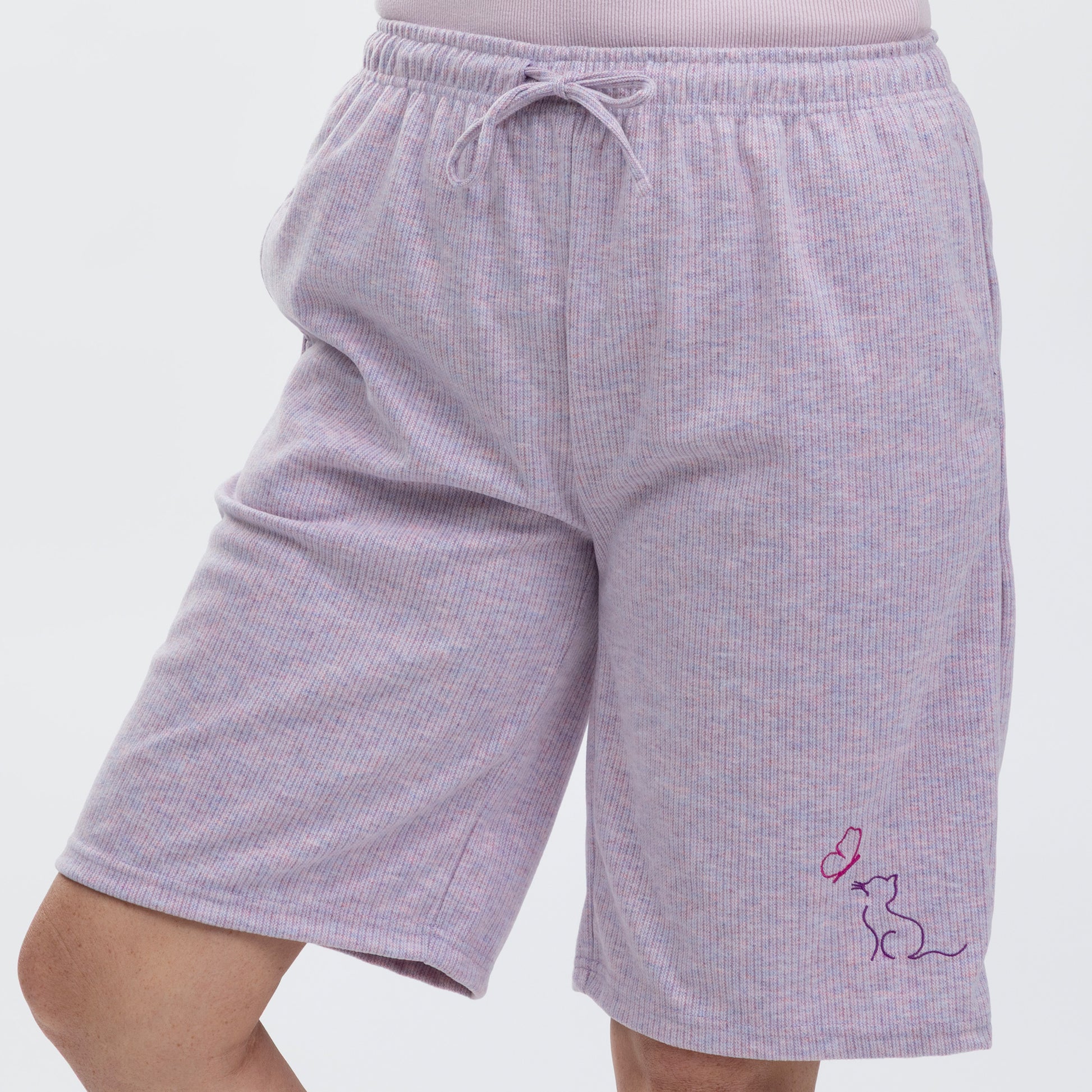 Light purple ribbed shorts with a small embroidered design on a plain white background.