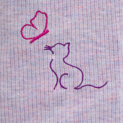 Embroidered design of a cat and a butterfly on melange purple fabric.