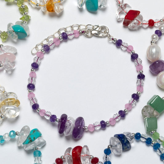 Colorful beaded bracelets on a white background