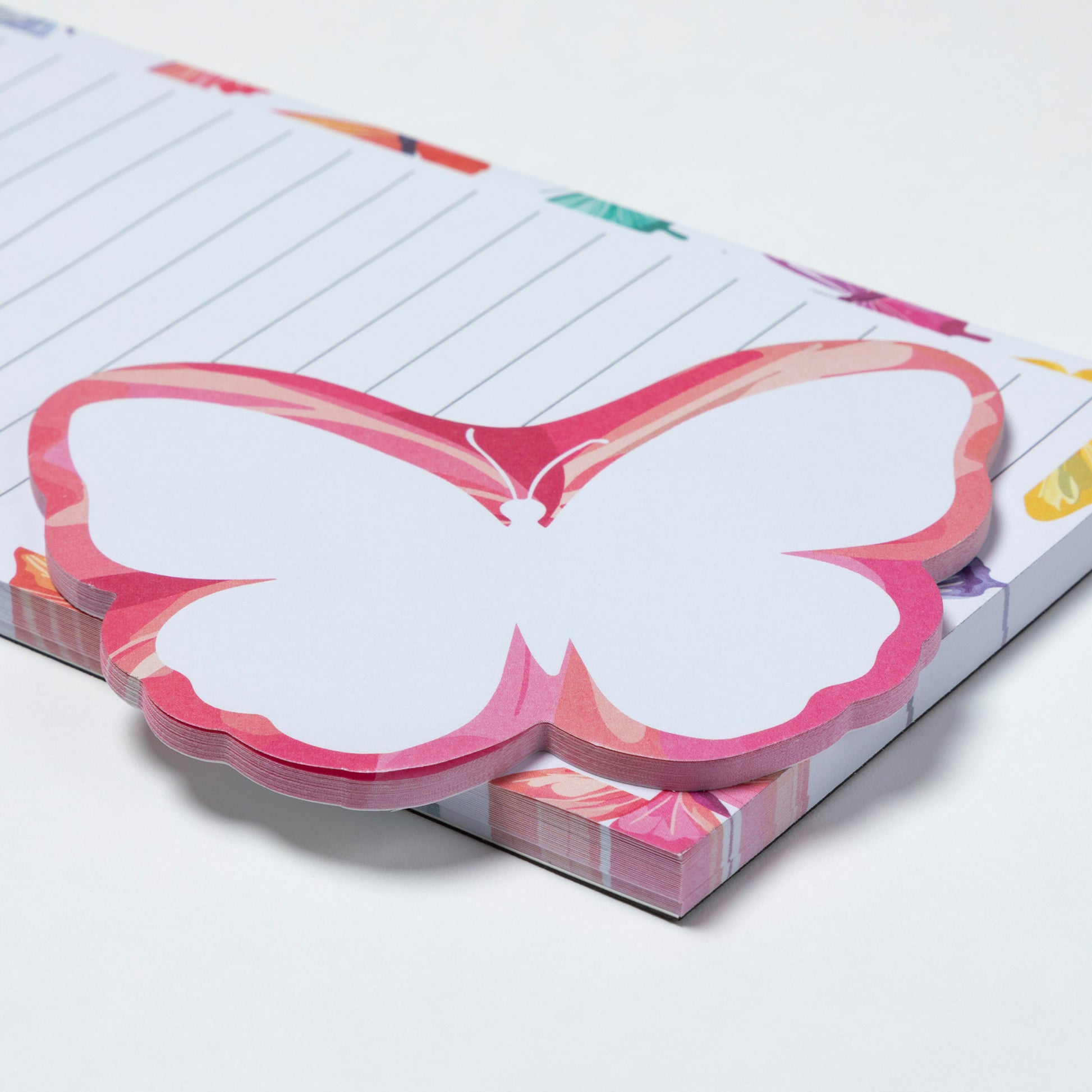 Butterfly-shaped sticky notes on a notebook with colorful design