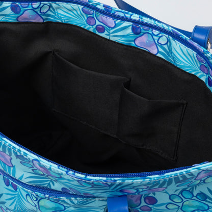 Close-up of a blue floral-patterned bag with a black interior pocket.