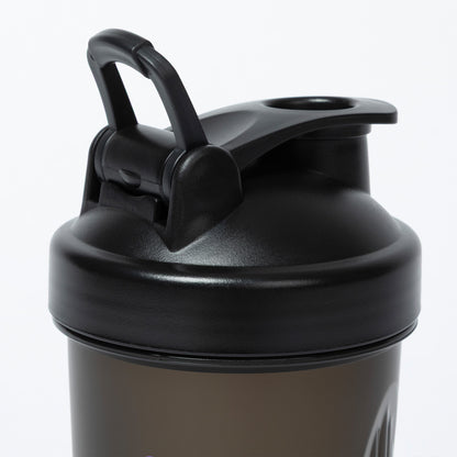 Black shaker bottle with a handle on a white background