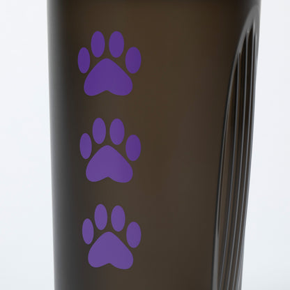 Black tumbler with purple paw prints on a white background