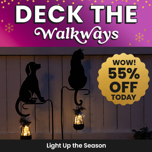 Deck the Walkways sale from The Animal Rescue Site and GreaterGood. Proceeds help support shelter pets and more. Features black metal dog and cat lantern stakes glowing warmly.