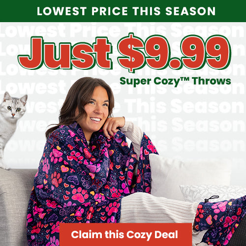 Super Cozy Throws donation from The Animal Rescue Site and GreaterGood, featuring a woman wrapped in a colorful paw-print throw, supporting animal-focused programs with a clear, accessible appeal.