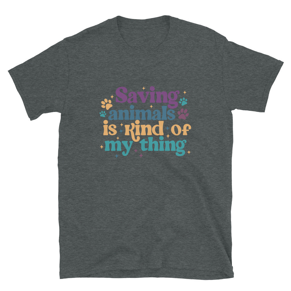 dark heathered gray shirt that reads Saving Animals is kind of my Thing with several paw print and sparkle images in a purple, yellow and blue font.