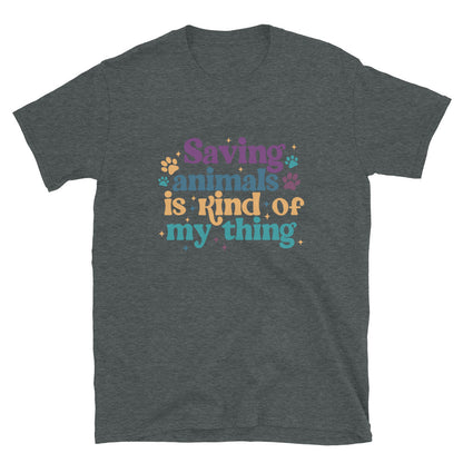 dark heathered gray shirt that reads Saving Animals is kind of my Thing with several paw print and sparkle images in a purple, yellow and blue font.