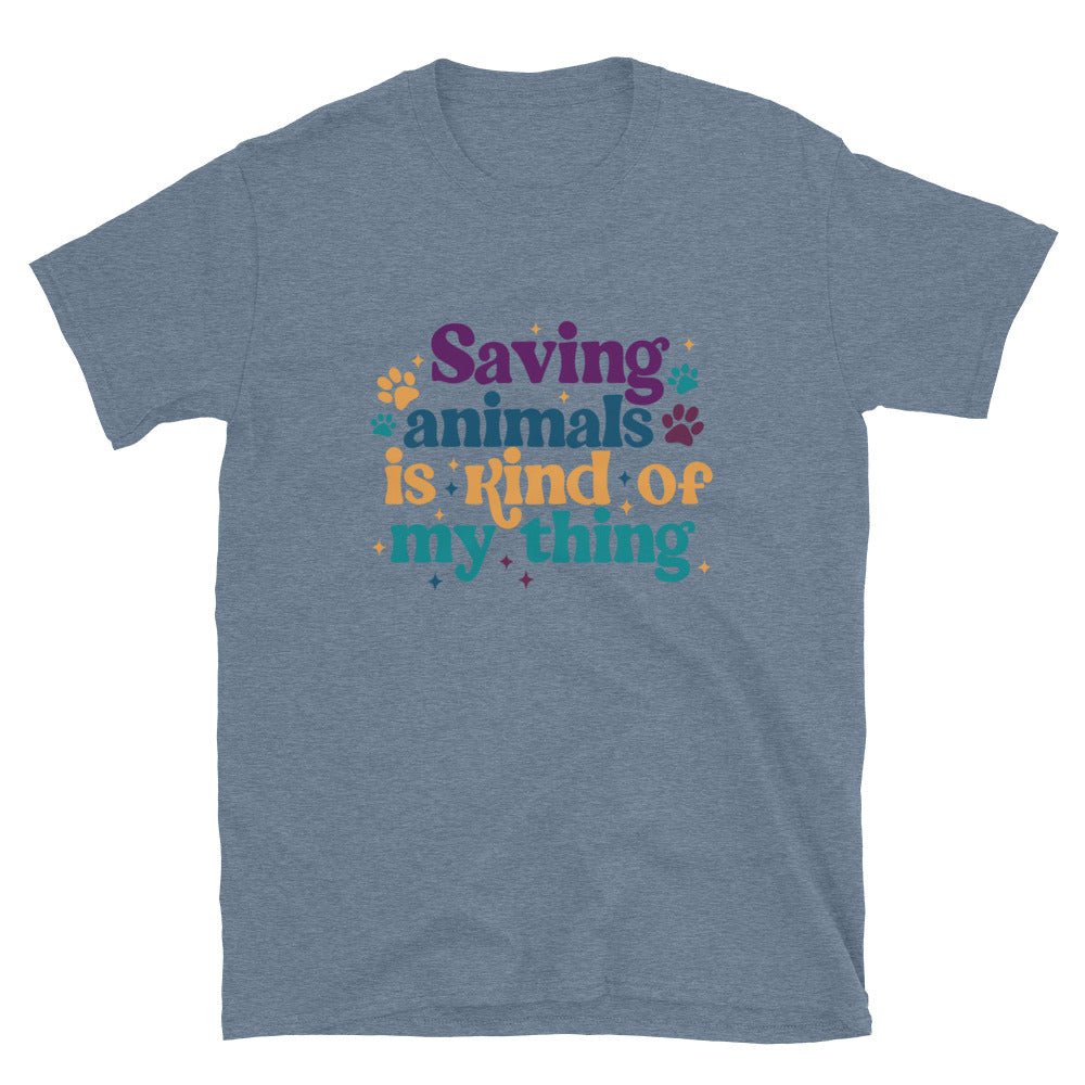 heathered indigo blue shirt that reads Saving Animals is kind of my Thing with several paw print and sparkle images in a purple, yellow and blue font.