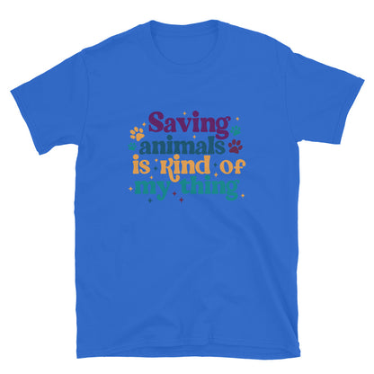 royal blue shirt that reads Saving Animals is kind of my Thing with several paw print and sparkle images in a purple, yellow and blue font.