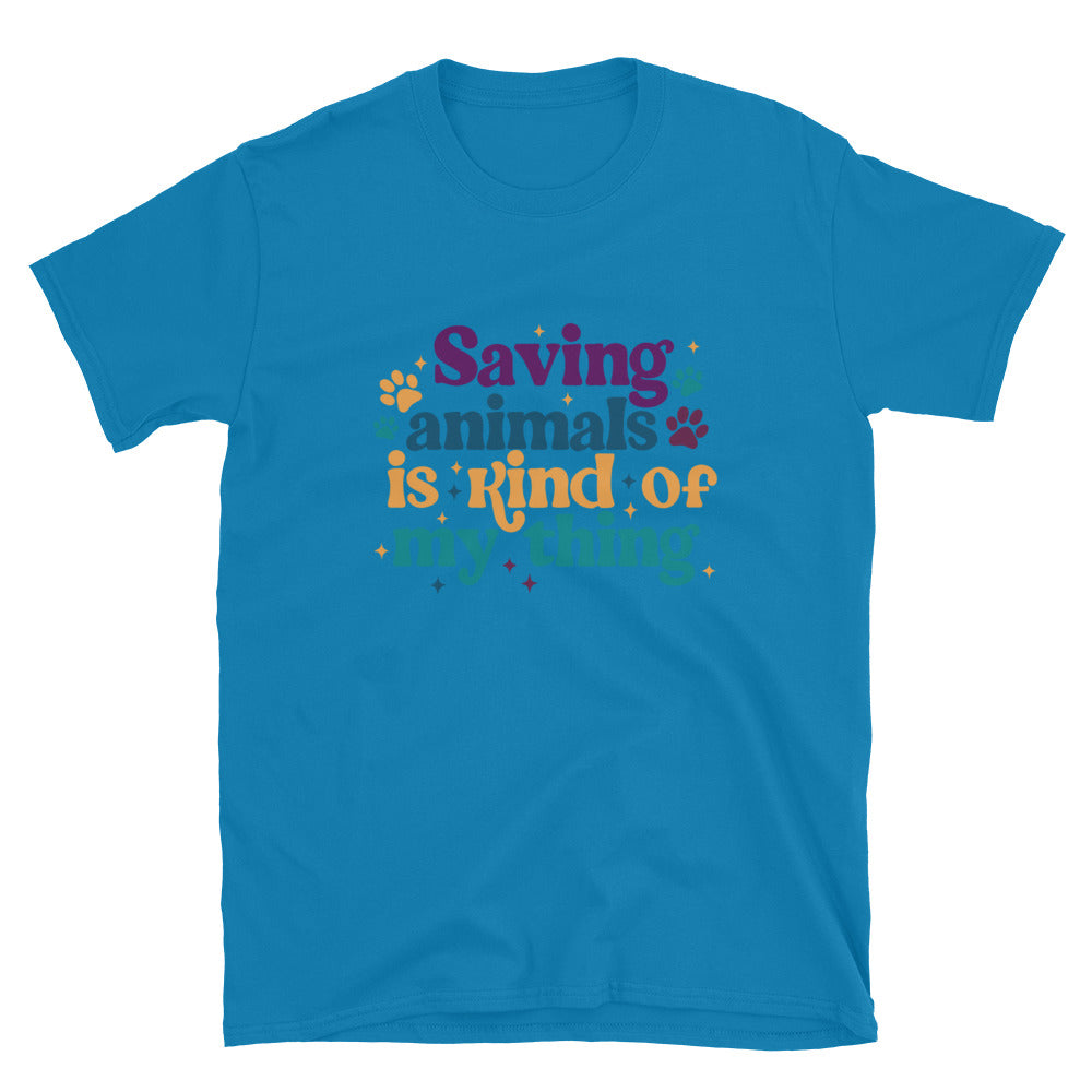 sapphire shirt that reads Saving Animals is kind of my Thing with several paw print and sparkle images in a purple, yellow and blue font.