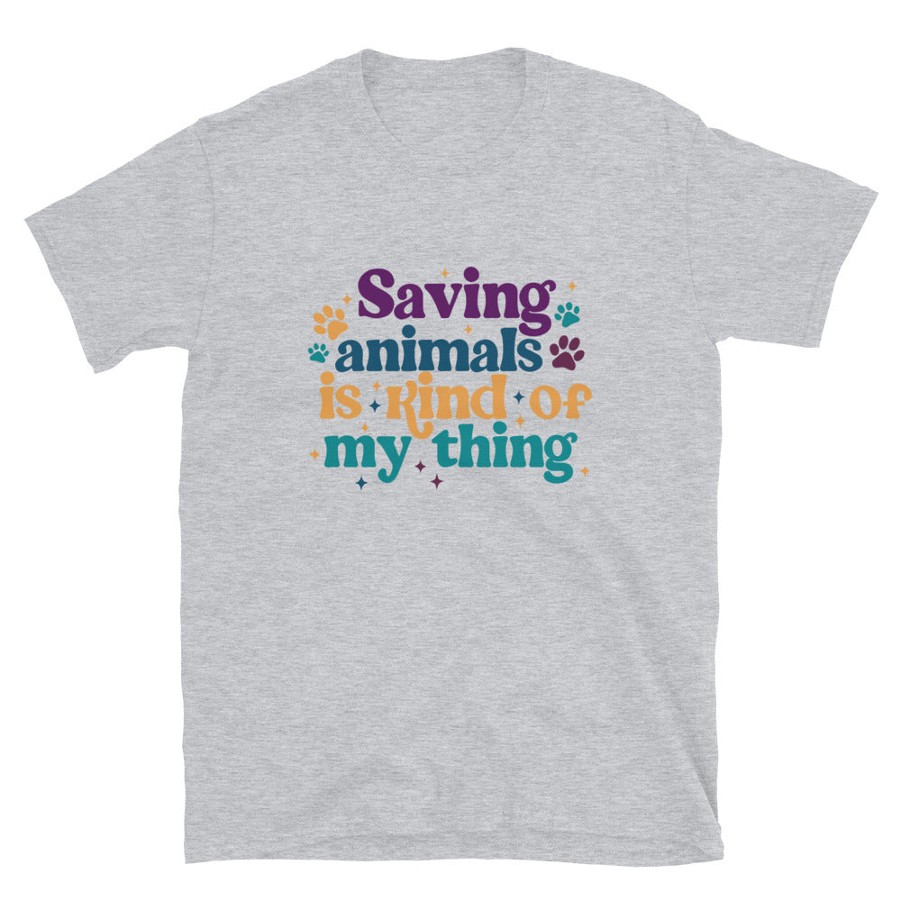 sports grey shirt that reads Saving Animals is kind of my Thing with several paw print and sparkle images in a purple, yellow and blue font.