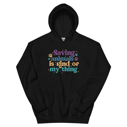 Black Hooded Sweatshirt that reads Saving Animals is kind of my Thing with several paw print and sparkle images in a purple, yellow and blue font.