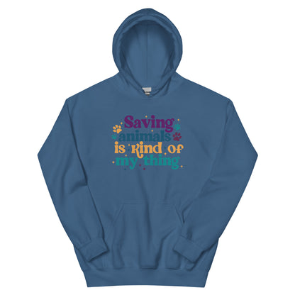Indigo Blue Hooded Sweatshirt that reads Saving Animals is kind of my Thing with several paw print and sparkle images in a purple, yellow and blue font.
