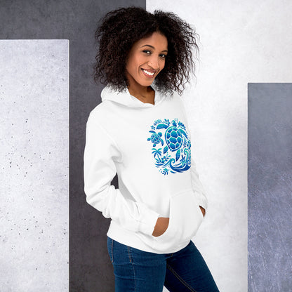 Woman wearing a white hoodie with a blue turtle design against a gray and white background