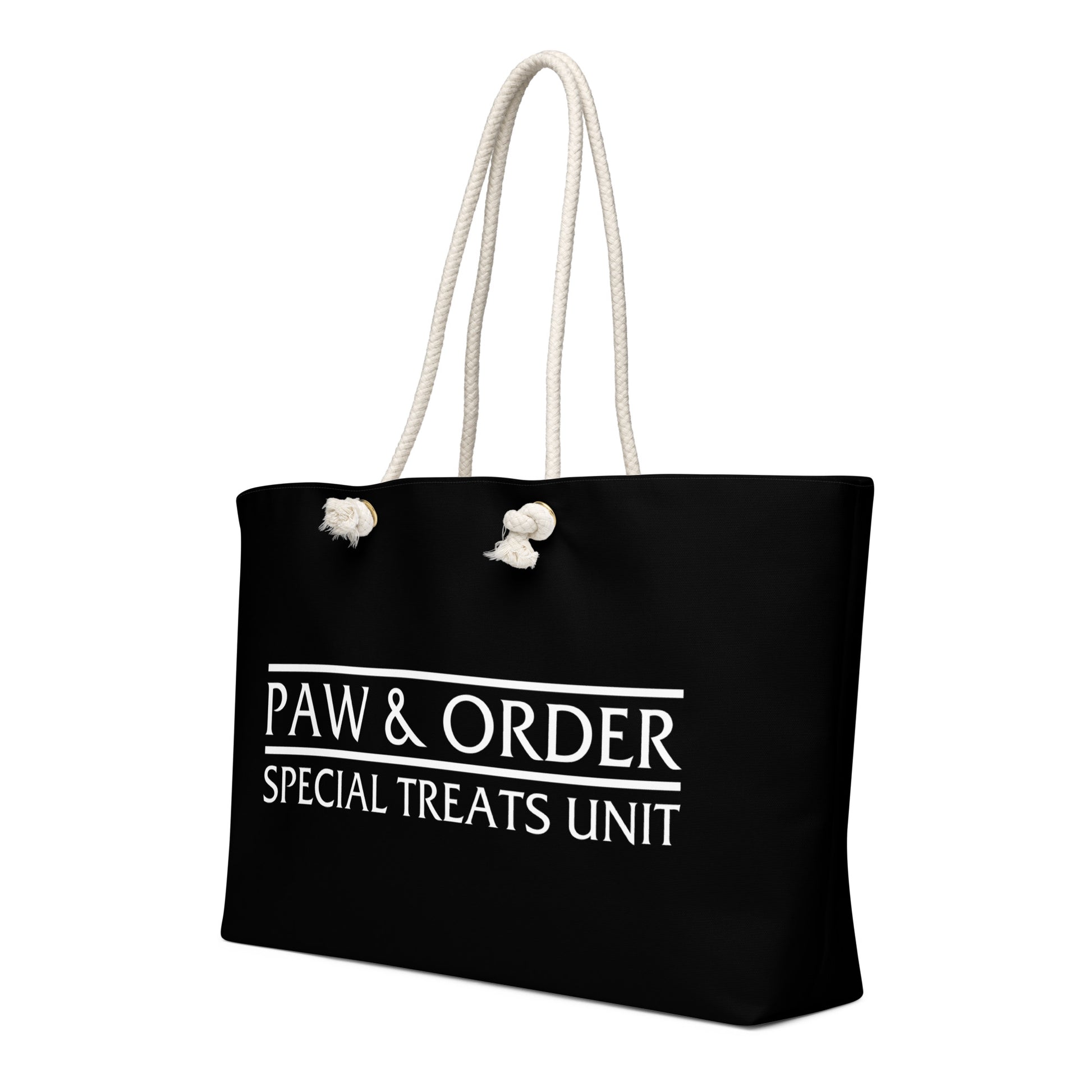 Right side view Black tote bag with tan rope handles. Design is black with white lettering that reads: Paw & Order- Special Treats Unit