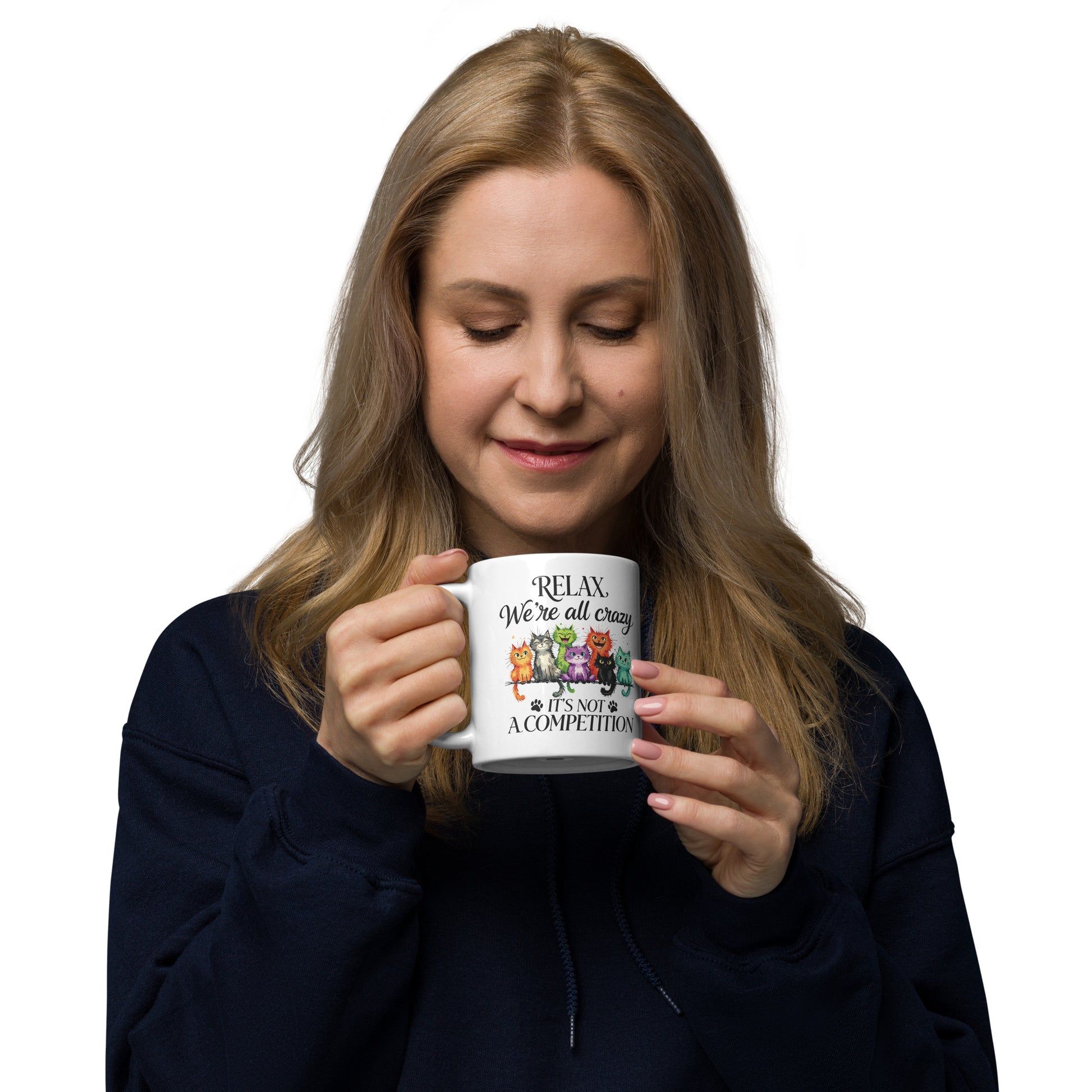 Woman holding a white mug with a black design on a white background