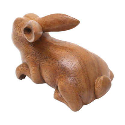 Curious Rabbit in Brown Handcrafted Suar Wood Rabbit Sculpture in Brown from Bali